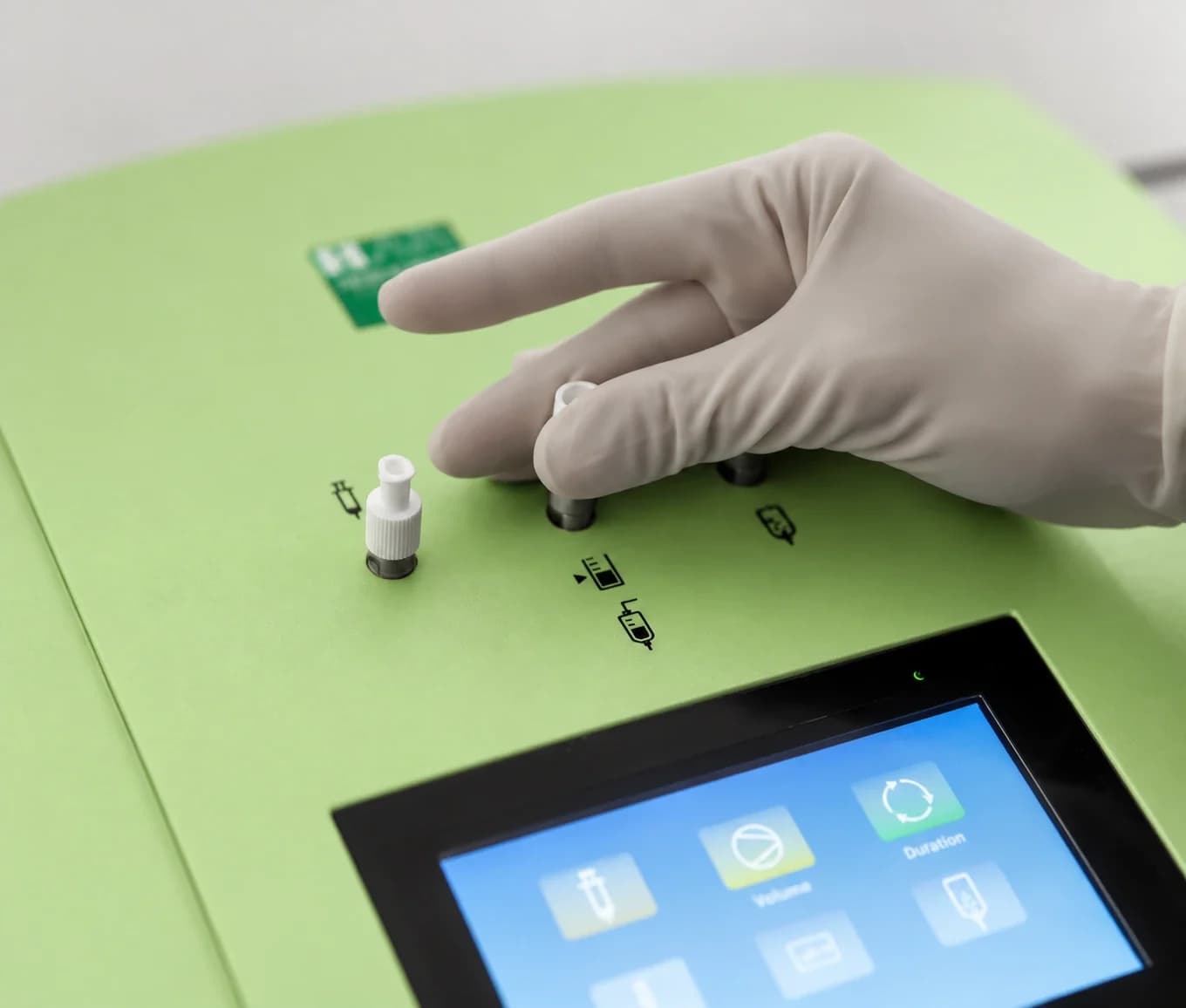 A gloved hand at the controls of the clinic's green Hyper Medozon comfort ozone system